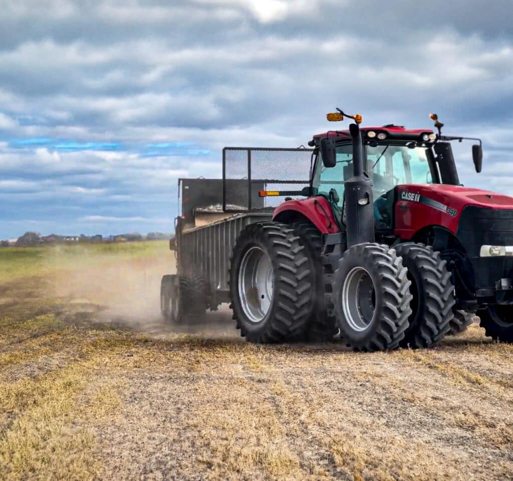 Spreading lime product in a field.